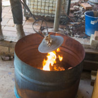 Pulling out the finished Raku fired piece